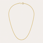 Collier Noa de OPALINE PARIS avec pendentif délicat en or et perles, porté sur un fond neutre.