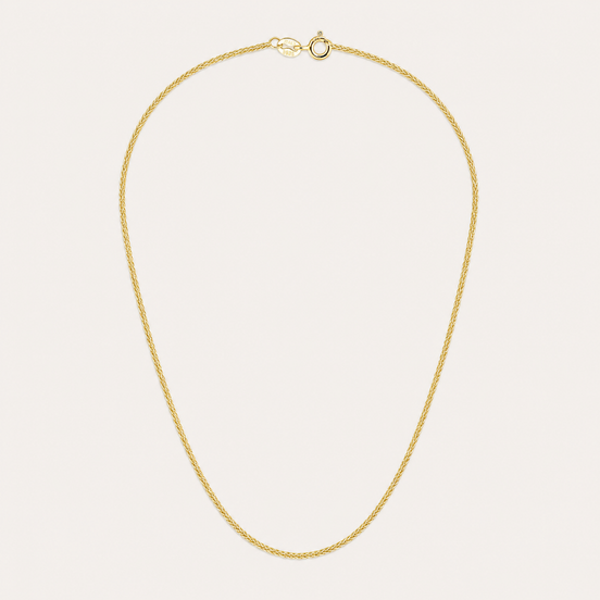 Collier Noa de OPALINE PARIS avec pendentif délicat en or et perles, porté sur un fond neutre.